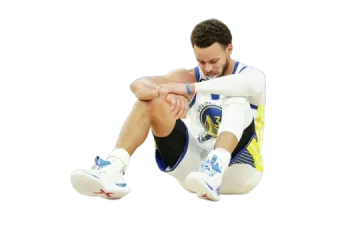 a man sitting on the ground with his legs crossed