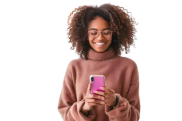 a woman in a pink sweater holding a cell phone