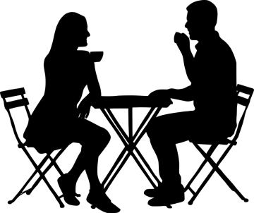 a silhouette of two people sitting at a table