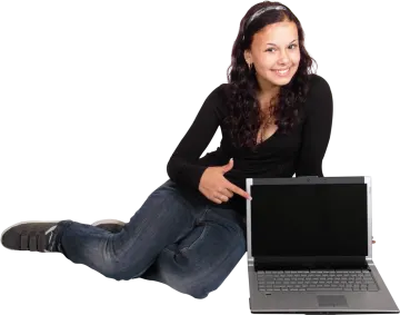 a woman sitting on the floor with her laptop