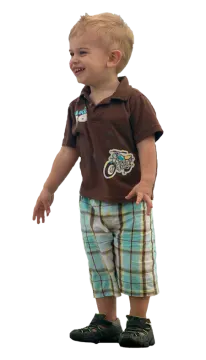 a young boy wearing a brown shirt and plaid shorts