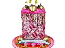 a birthday cake with pink and gold decorations