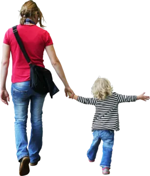 a woman holding the hand of a child