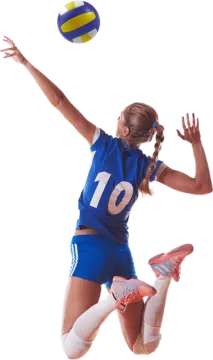 a woman jumping in the air to hit a volleyball ball