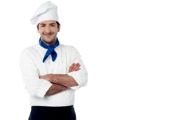 a chef standing with his arms crossed