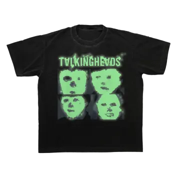 a black t - shirt with two green faces on it