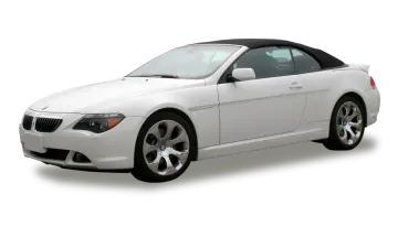 a white bmw convertible with a black top