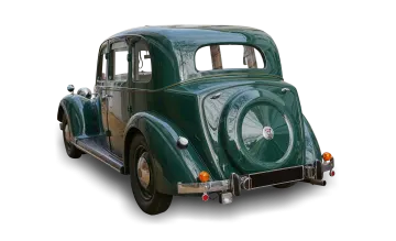 an old green car on a white background