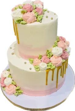 a white cake with pink and green flowers on top