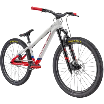 a white mountain bike with red and blue accents