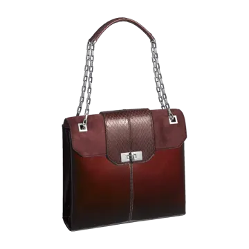 a brown and black handbag on a white background