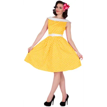a woman wearing a yellow and white polka dress