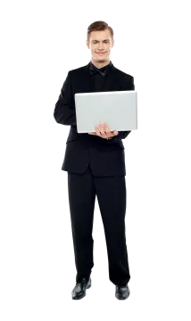 a man in a suit holding a laptop