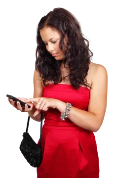 a woman in a red dress looking at her cell
