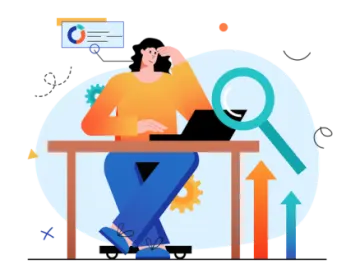 a person sitting at a desk with a laptop