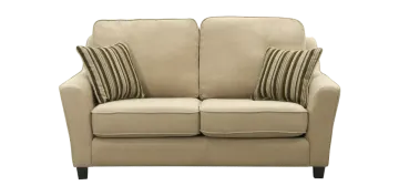 a beige couch with two pillows on it