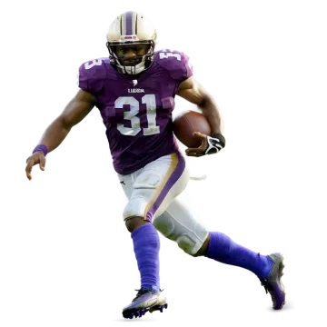 a football player running with the ball in his hand
