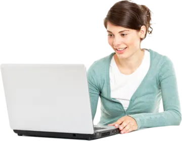 a woman sitting at a table with a laptop