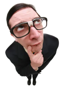 a man in a suit and glasses is making a funny face
