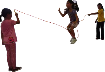 a little girl flying a kite in the air