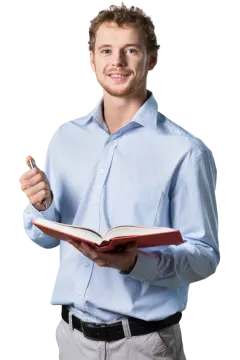 a man holding a pen and writing on a book