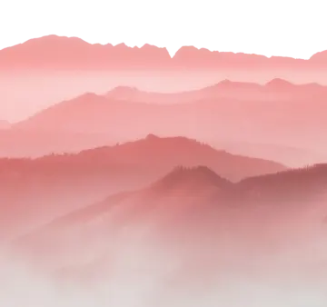 the mountains are covered in fog