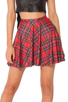 a woman wearing a black top and red plaid skirt