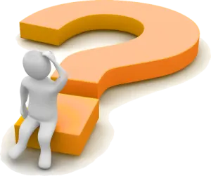 a person standing in front of a question sign