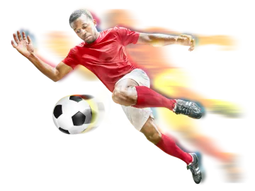 a man in a red shirt kicking a soccer ball