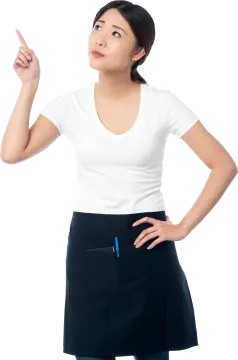 a woman in an apron pointing at something