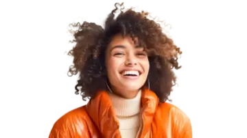 a woman wearing an orange leather jacket and smiling