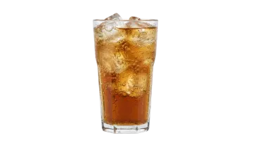 a tall glass filled with ice and cola