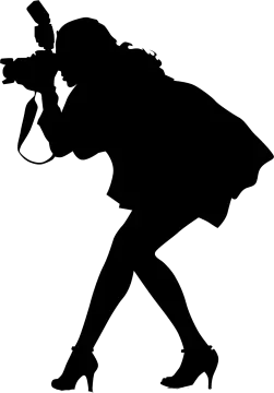 a silhouette of a woman with a camera