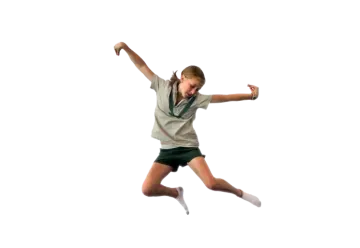 a young girl is jumping in the air