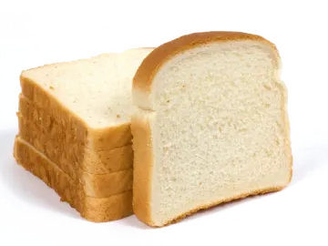 a loaf of white bread on a white background