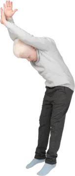 a young boy is doing a trick on his skateboard
