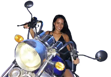 a woman sitting on the back of a motorcycle
