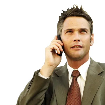 a man in a suit talking on a cell