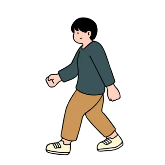a person walking down the street with their hands in their pockets