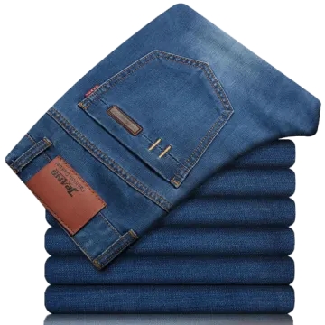 a stack of blue jeans on a white background