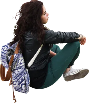 a woman sitting on the ground with a backpack