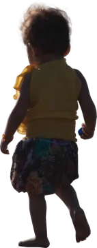 a little girl in a yellow shirt and floral skirt