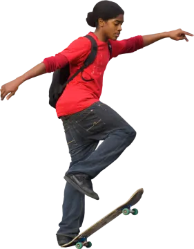 a young boy is doing a trick on his skateboard