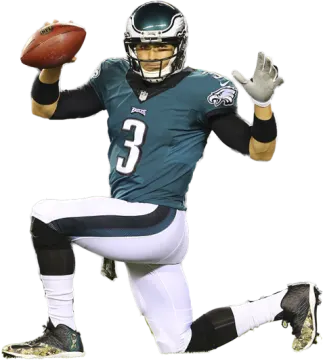 a man in a uniform holding a football ball