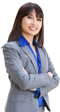 a woman in a business suit with her arms crossed