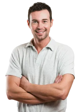 a smiling man with his arms crossed