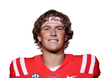 a man in a red jersey holding a football ball