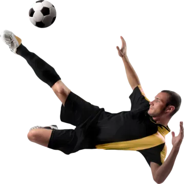 a man kicking a soccer ball in the air