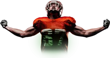 a man in an orange and green uniform holding his hands up