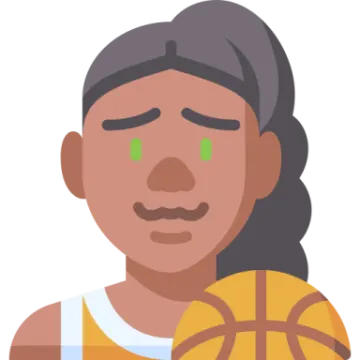 a woman with green eyes holding a basketball ball